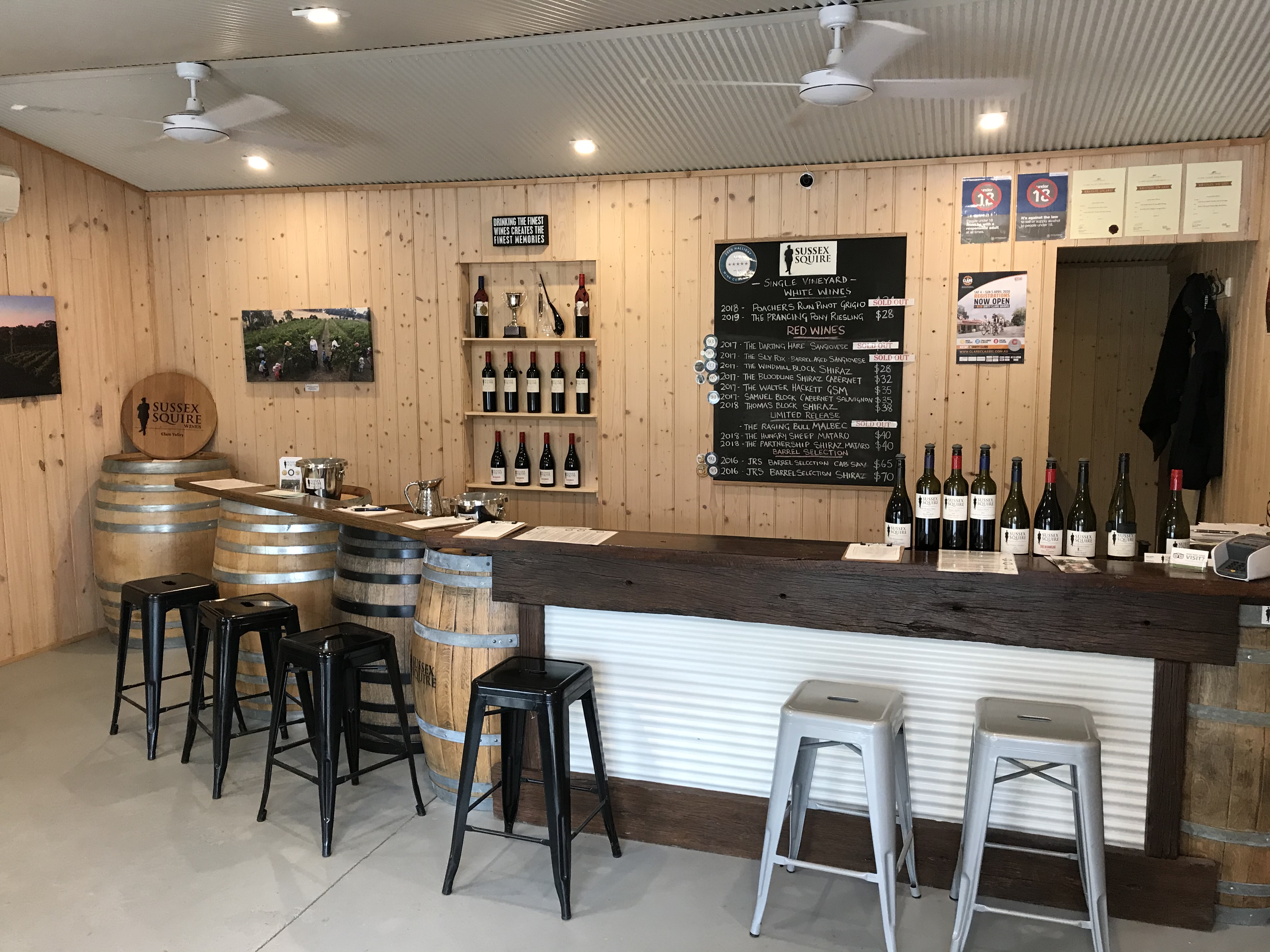 Wine bar with stools and barrels